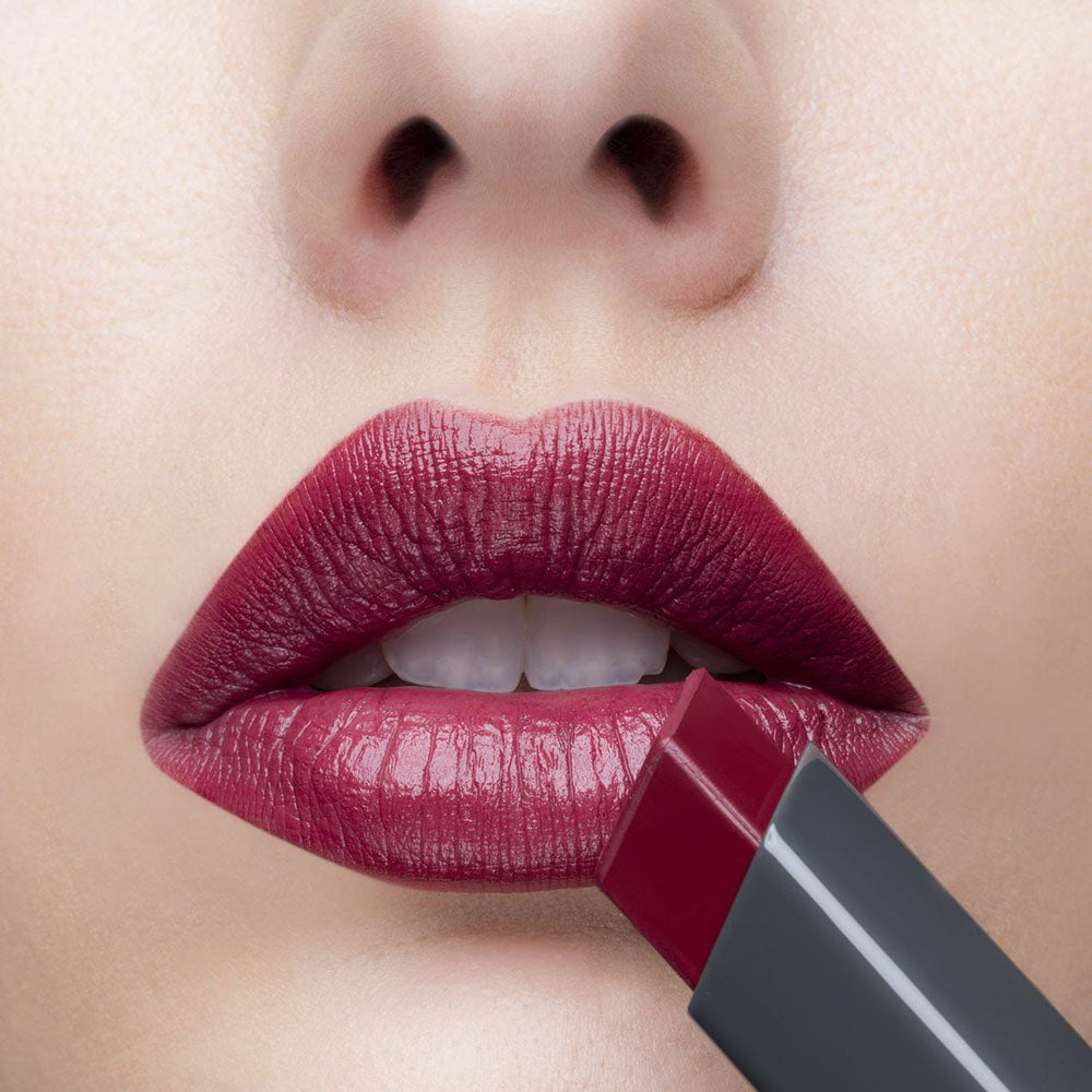 Woman Applying Lique Stunning Cream Lipstick